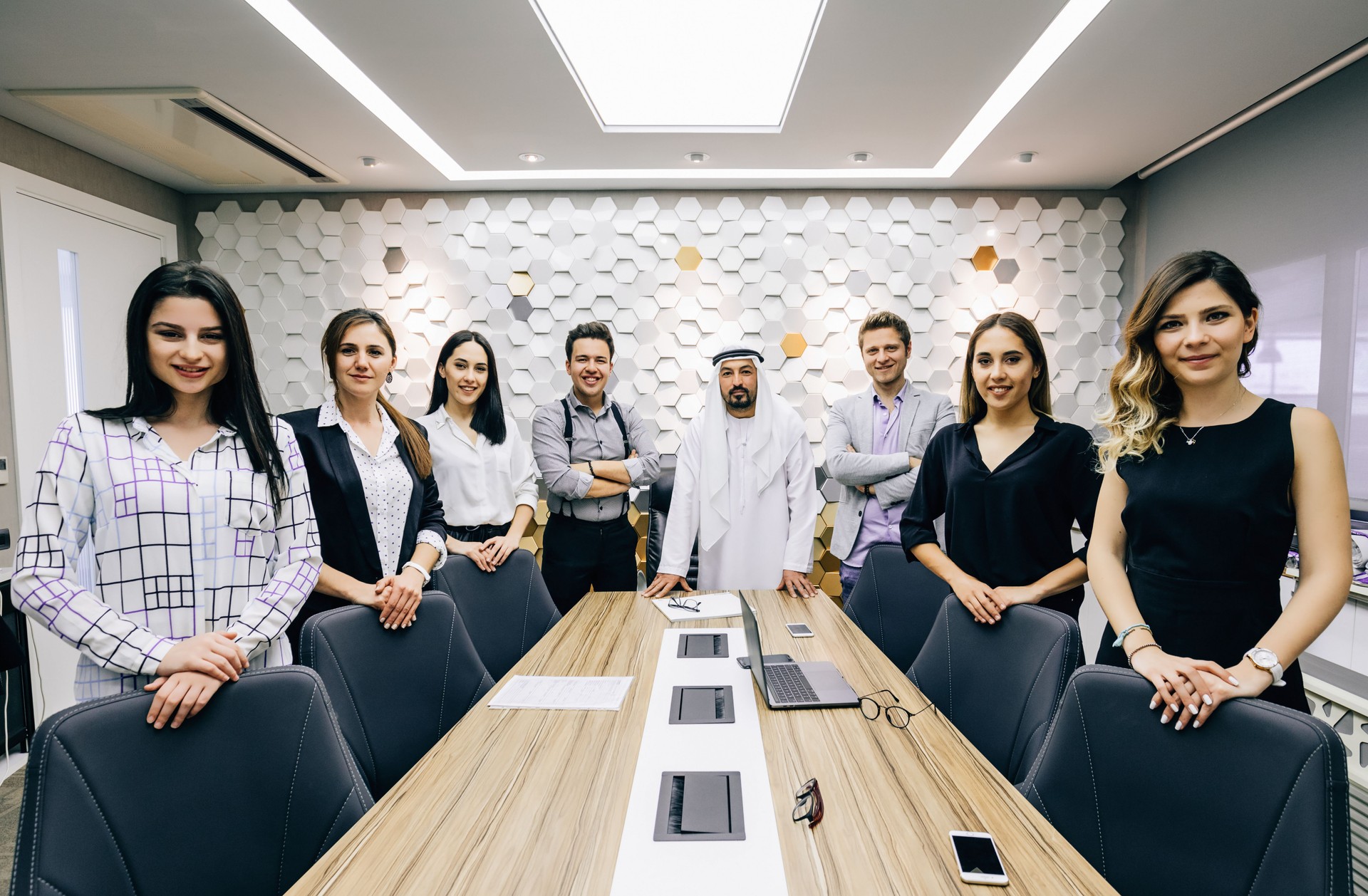 Business team having a business meeting with Arab businessman in office